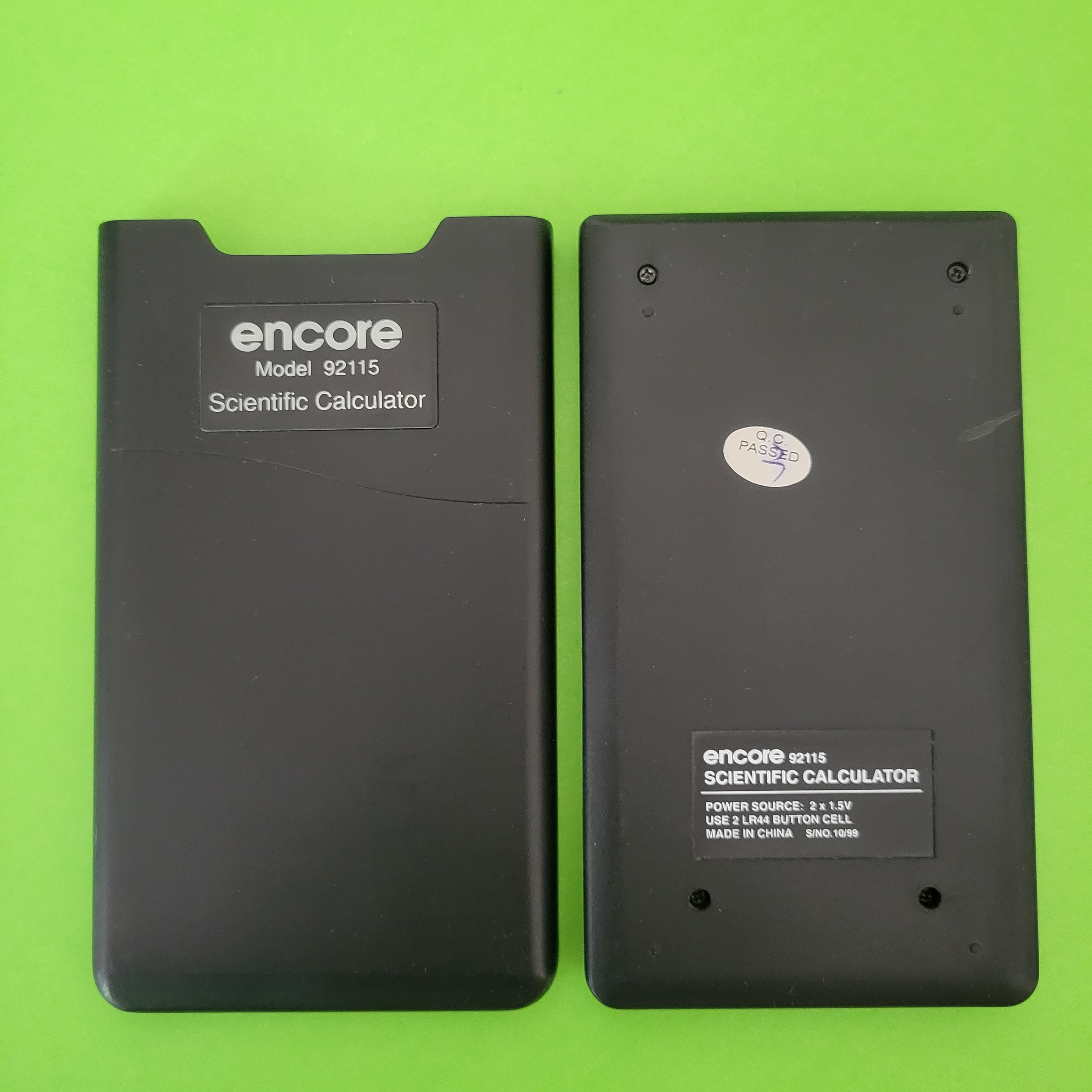 An image of the back of a encore 92115 scientific/engineering calculator